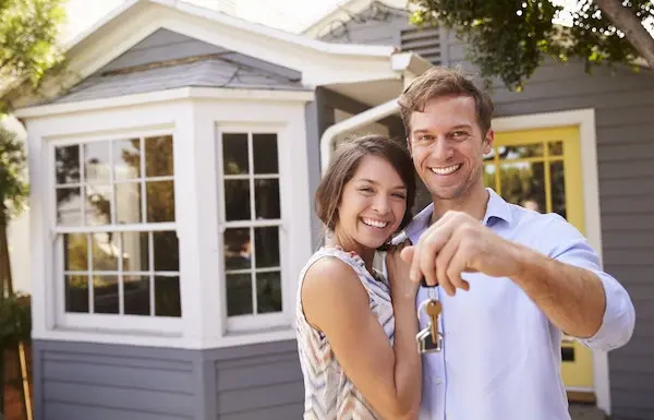 happy couple buying a home
