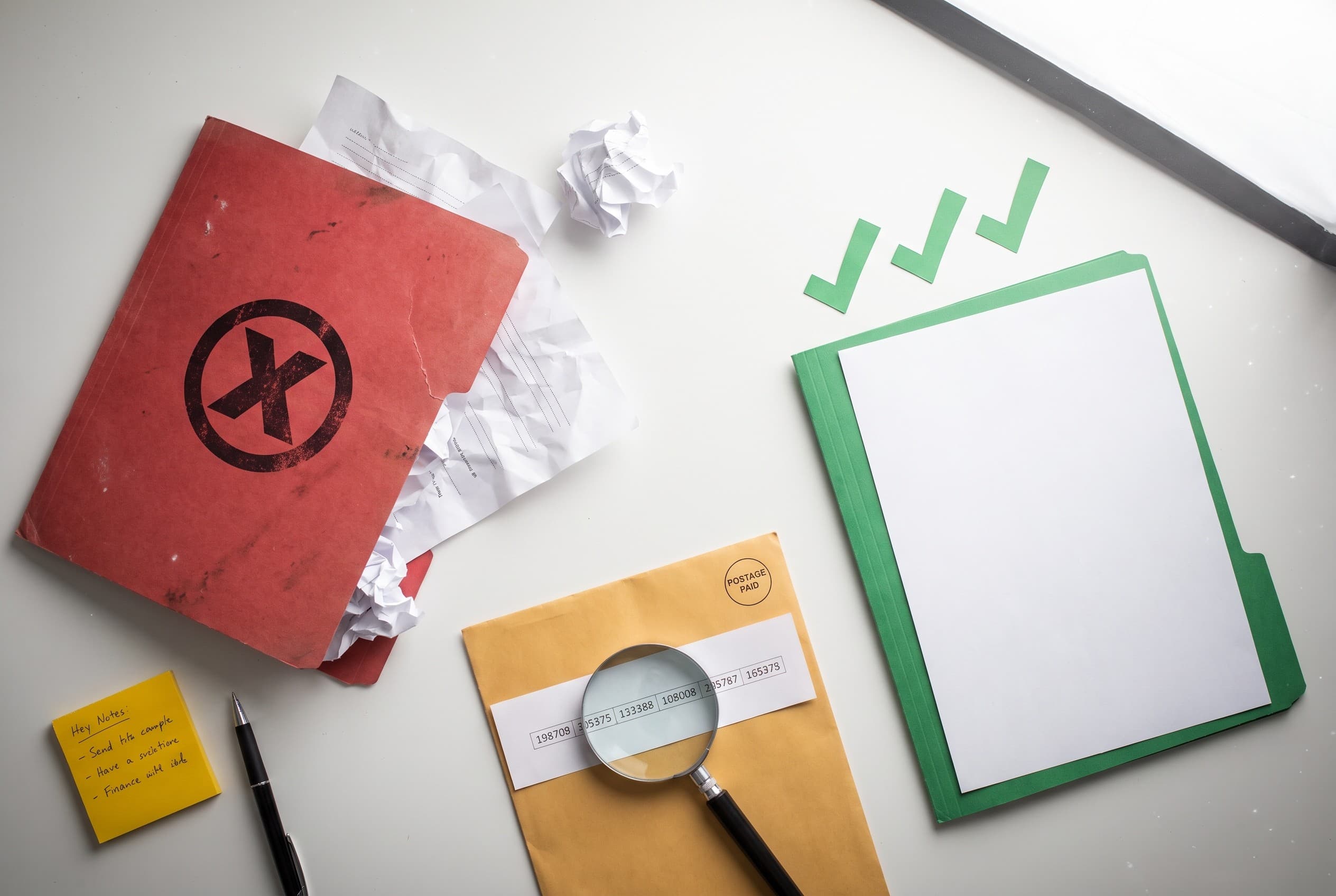 Top-down flat-lay photo on a clean white desk showing a credit dispute concept. On the left, a red folder stamped with a larg